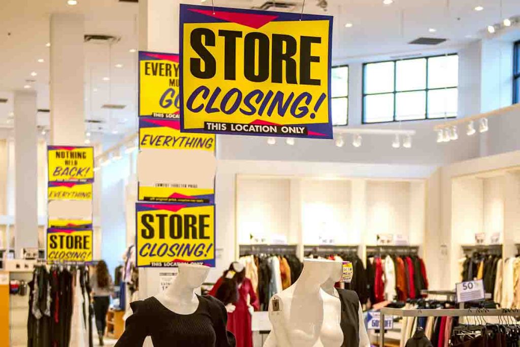 JCPenney storefront with 'Store Closing' signs displayed.