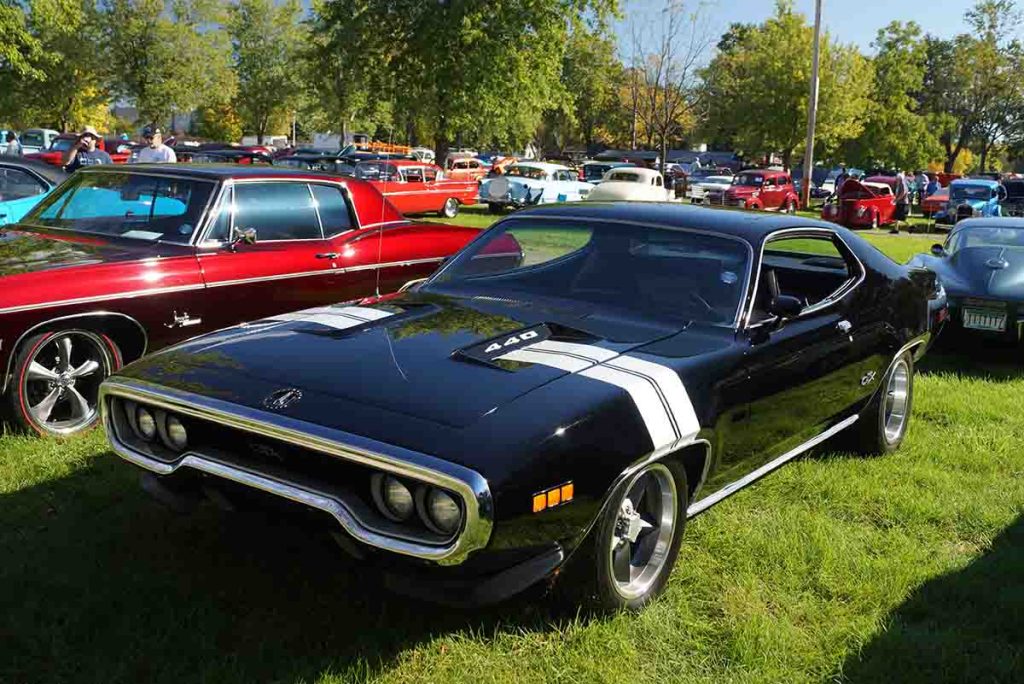 Classic Plymouth GTX muscle car with 426 HEMI parked.
