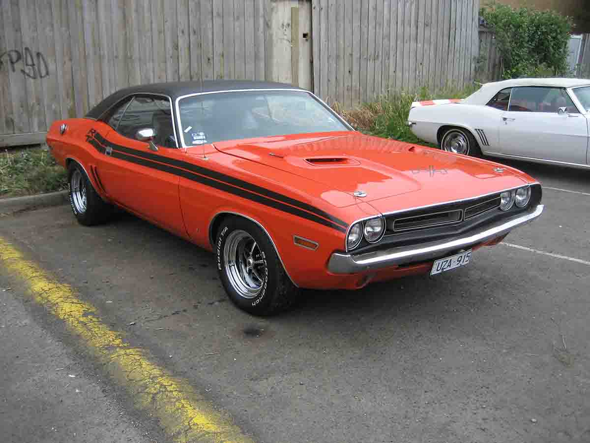 1971 Dodge Challenger RT 440 in red with rally stripes and hood scoop